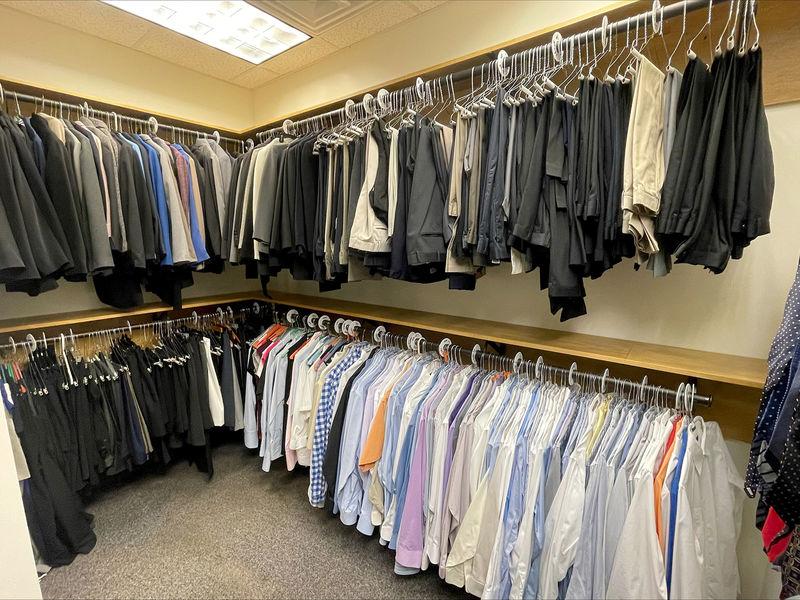 Double-decker racks of professional dress attire for men and women